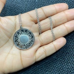 Vintage zodiac sign pendant with chain.